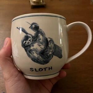 Molly Hatch for Anthropologie blue and white ceramic sloth mug